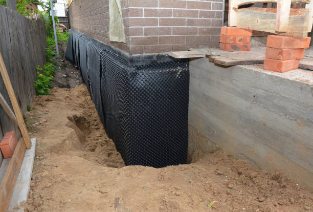 SJ Waterproofing Pros technician performing targeted Exterior Waterproofing assessment in Georgetown, KY